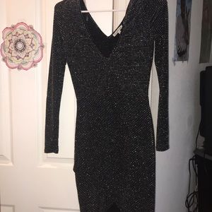 Knee length black party dress.